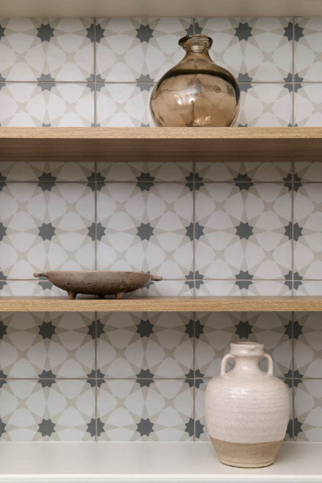 open shelving in kitchen with mosaic backsplash